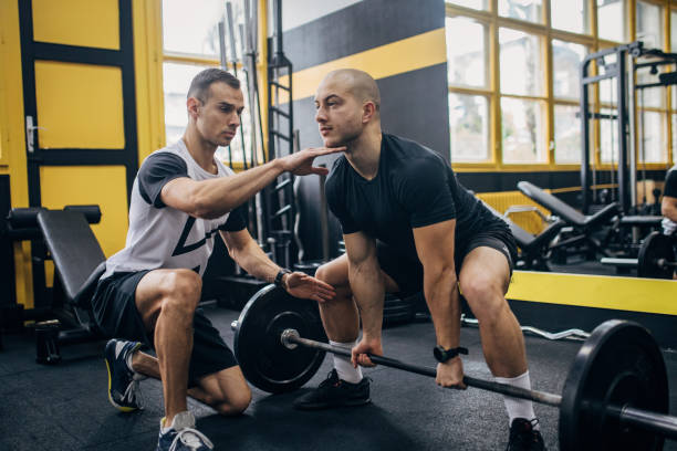 istock Weightlifting practice in gym 1470029506
