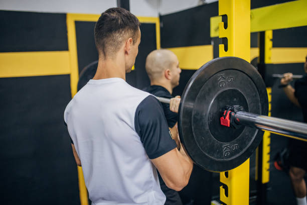 istock Weightlifting practice in gym 1470029620