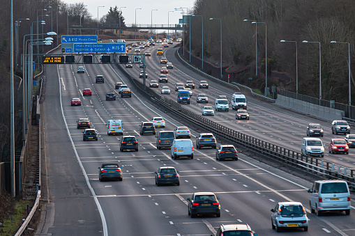 Chorleywood, UK - February 25, 2023: British road transport. Evening traffic on busiest British motorway M25
