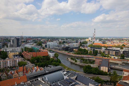 Top aerial view of Wroclaw. City center with colorful houses with red roofs and and river with a bridges. Poland