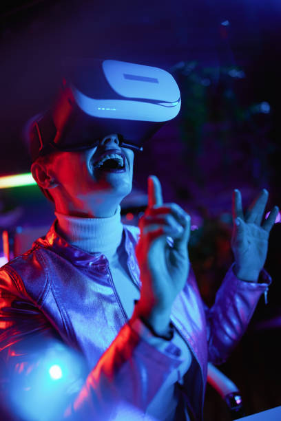 istock smiling elegant 40 years old woman in virtual reality goggles 1470031570