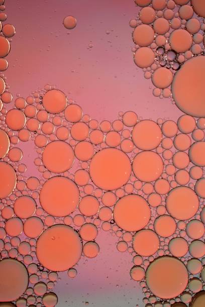 istock multi colored oil circles on the water, colorful background 1470032780