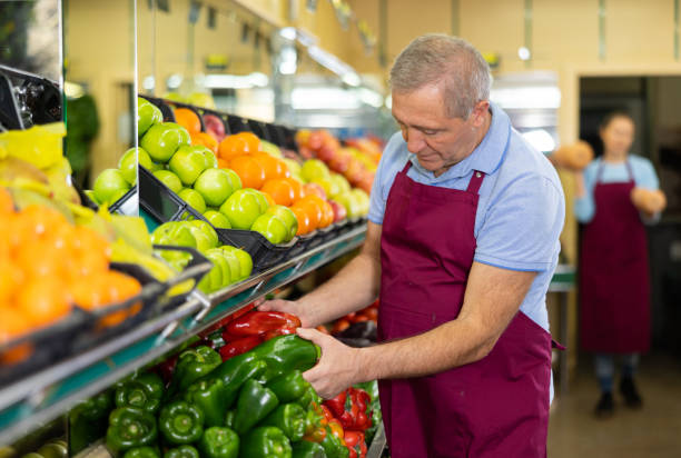 istock male seller selling peppers 1470033023