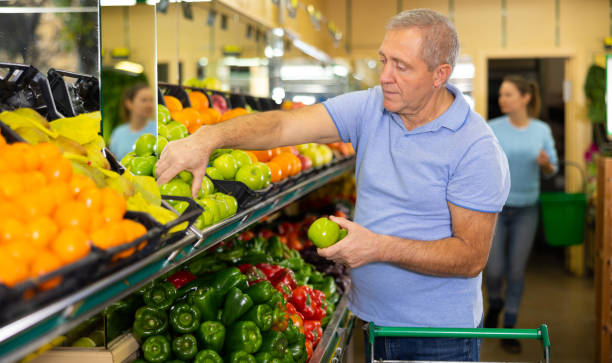 istock man buys apples in  supermarket 1470033041