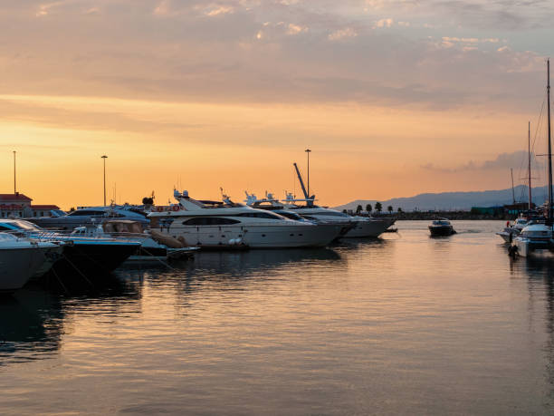 istock seaport, harbor, jetty at sunset. Calm sea and cloudy sky 1470033052