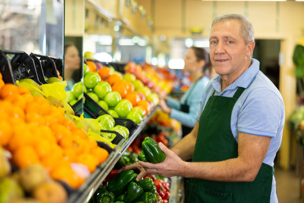 istock male seller selling peppers 1470033898