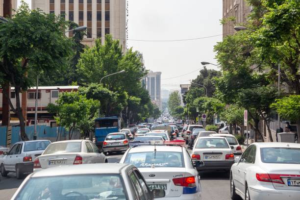 gridlocked traffic clogs a road in central tehran, iran. - domestic car color image horizontal car imagens e fotografias de stock