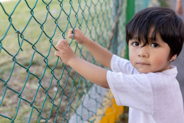 istock Mexican innocent child looking at camera outdoors, children's day 1470034637