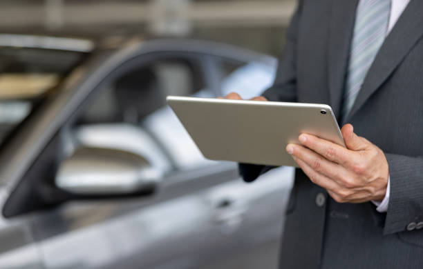 istock Close-up on a car salesperson using a tablet computer 1470035653