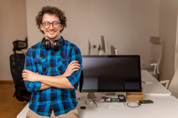 istock Smiling mid adult man in his small office 1470035777