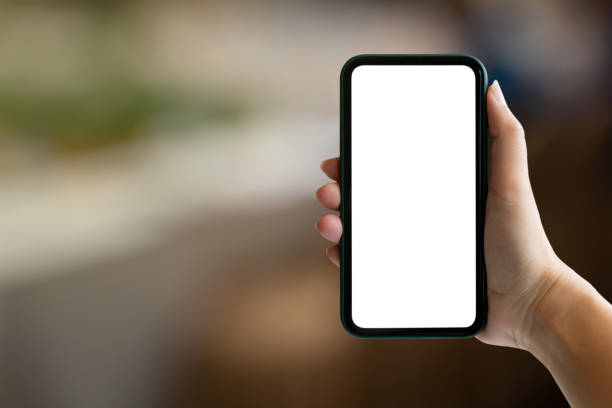 istock Woman hand's holding empty screen mobile phone at cafe. 1470035780