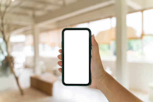 istock Female hand's holding empty screen mobile phone. 1470035843