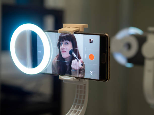 istock Influencer recording makeup vlog on phone 1470036958