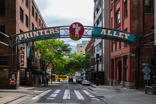 Nashville, Tennessee USA - May 9, 2022: Printers Alley is a popular tourist destination in the downtown district with entertainment venues