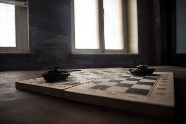 istock War between Russia and Ukraine, conceptual image of war using chess board and tank on a dark background of explosion. Ukrainian and Russian crisis, political conflict. Selective focus 1470037231