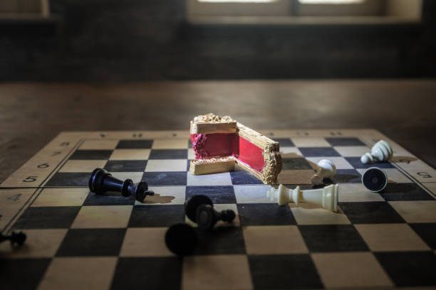 istock Red royal chair miniature on wooden table. Medieval Throne on chessboard. Chess board game concept of business ideas and competition and strategy ideas concept. Selective focus 1470037253