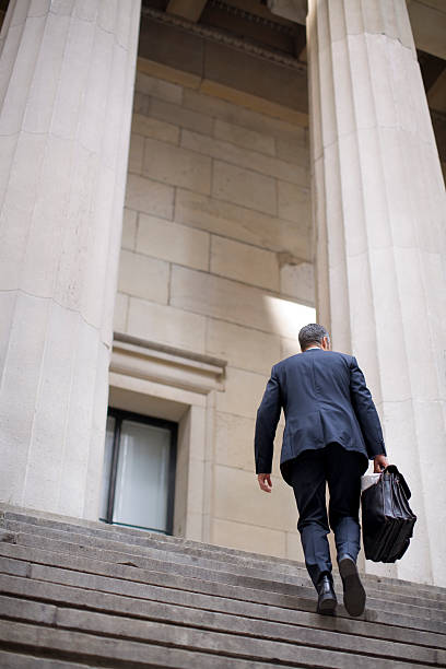 istock Businessman running up the steps of power 147003738