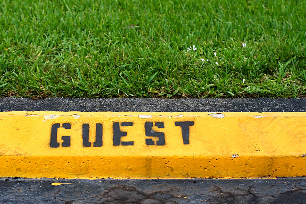 istock Yellow guest parking curb 147003800