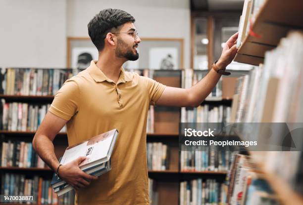 Student Man Search Bookshelf And Library For Reading Information And Knowledge At University College Student Research And Studying For Education College And Learning For Scholarship In Marseille Stock Photo - Download Image Now