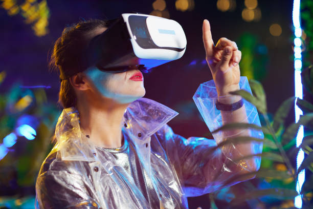 istock modern woman in metaverse pressing button in air 1470038883