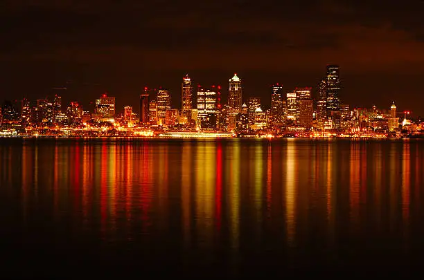 A dazzling photograph of Seattle skyline reflected across water