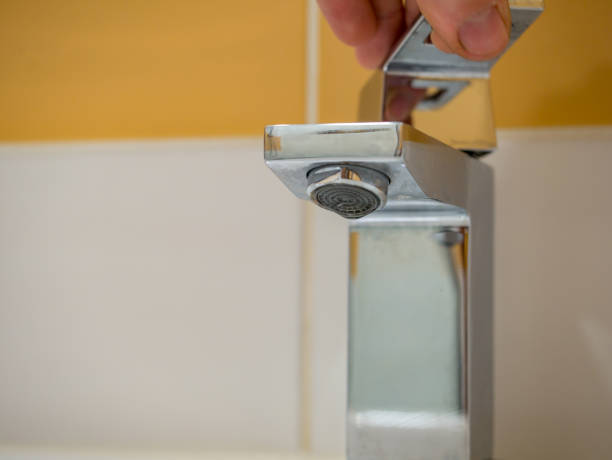 istock Running water from a square faucet in a modern bathroom 1470040309