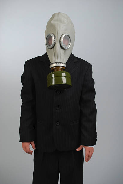 Child in a gas mask stock photo