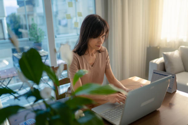 istock Woman working on laptop at home 1470045507