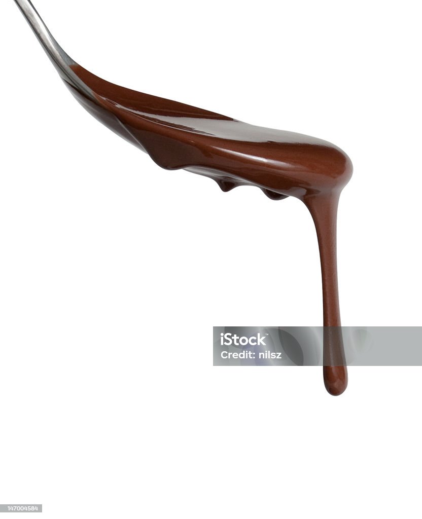 Melted chocolate dipping from a spoon Chocolate dripping from spoon Chocolate Stock Photo