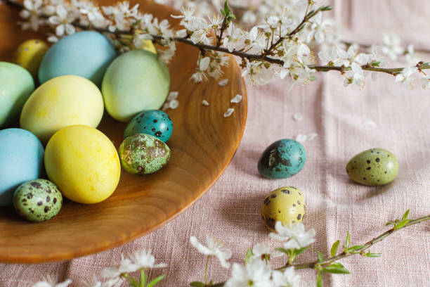 istock Stylish natural dyed easter eggs on wooden plate with spring flowers on rustic table. Happy Easter! Rustic Easter still life 1470048263