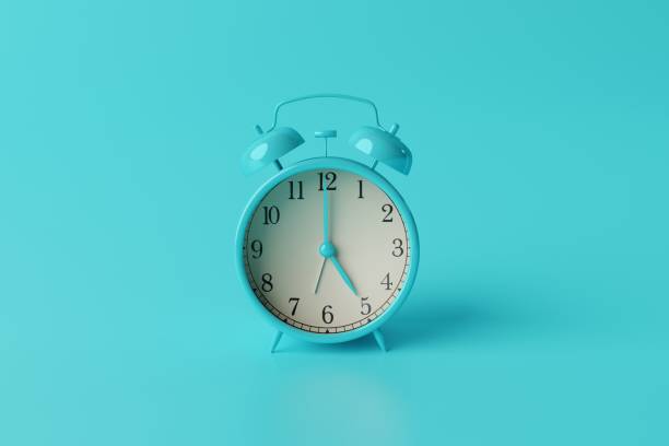 istock Turquoise retro alarm clock on turquoise background. 1470051837