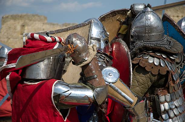 fight of medieval knights - uitbeenhandschoen stockfoto's en -beelden