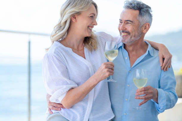 istock Mature couple drinking and toasting with wine. 1470054198