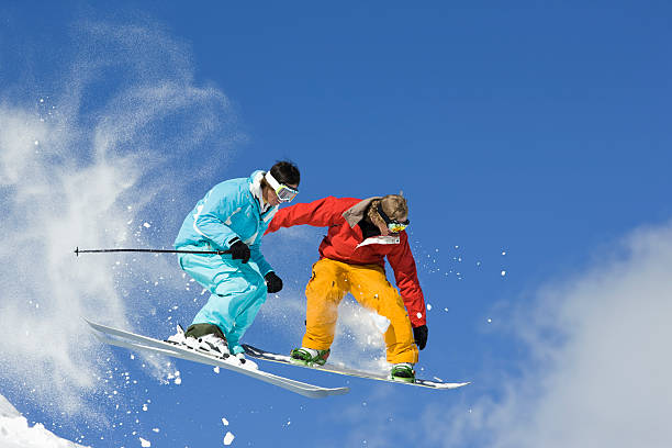 istock Competition - Skier Vs. Snowboarder Jump 147005591