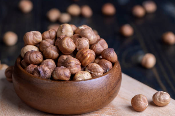 istock Peeled hazelnuts during cooking, close-up of freshly picked hazelnuts in the kitchen 1470056628
