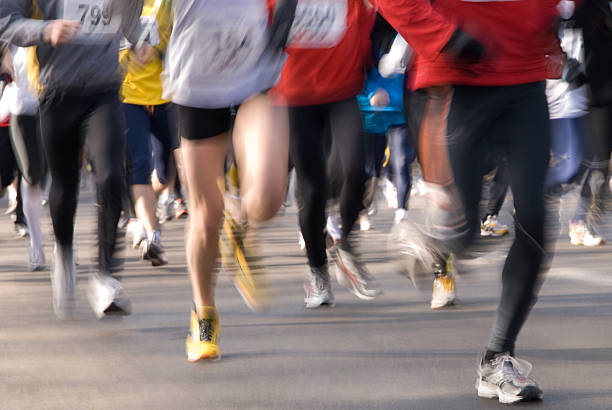 istock Blurred group of marathon runners during a race 147005828
