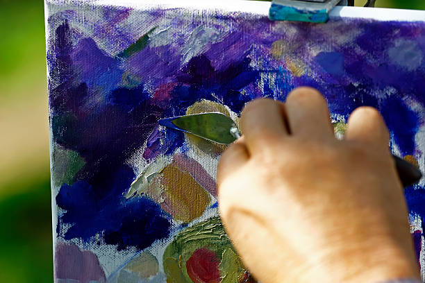 istock Artist working on a painting 147005887