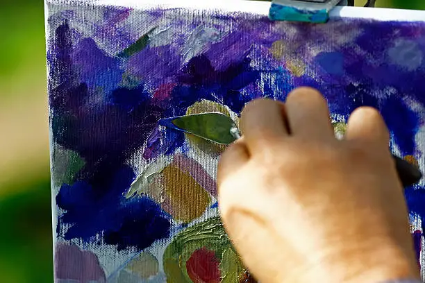 Artist working on a painting