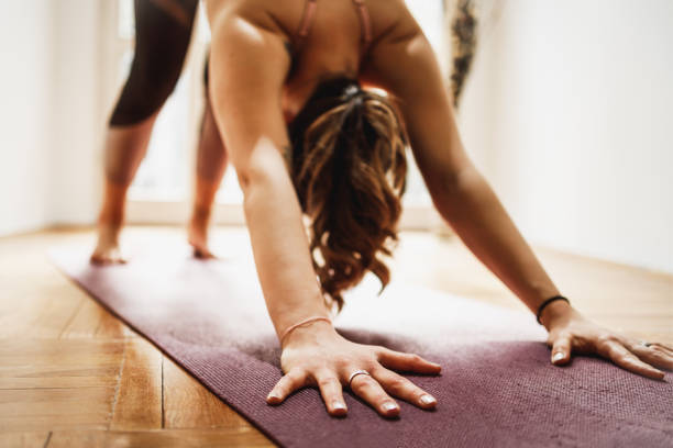 istock Woman Doing Yoga At Home 1470060180