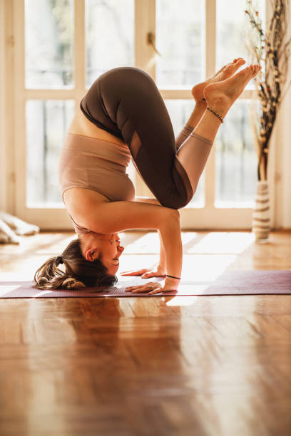 istock Woman Doing Yoga At Home 1470060768