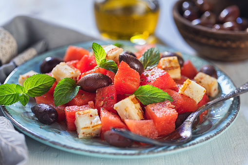 Watermelon salad with grilled halloumi cheese on a plate