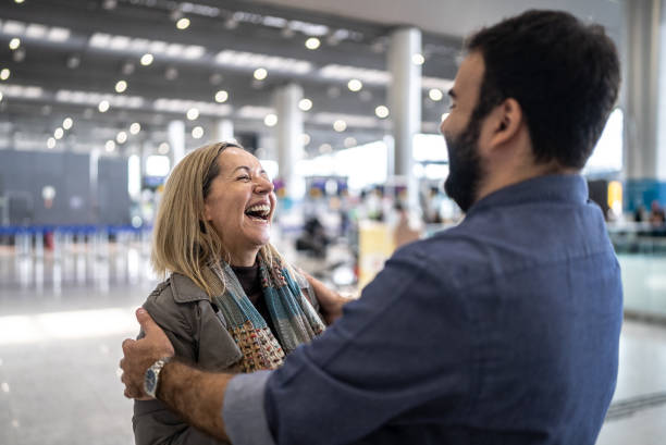 istock Friends talking in the airport 1470065111