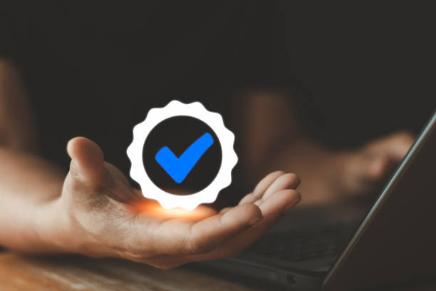 istock Standard, Quality control, ISO certification, assurance and guarantee. Hand showing symbol quality assurance and standard, concept ISO certification of excellent service. for customer satisfaction. 1470065350