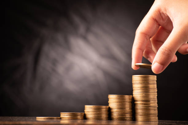 Mutual fund or systematic investment plan concept, putting coin on coin stack