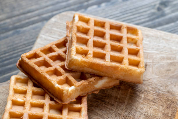 istock Soft fresh waffles with bee honey close-up 1470066786