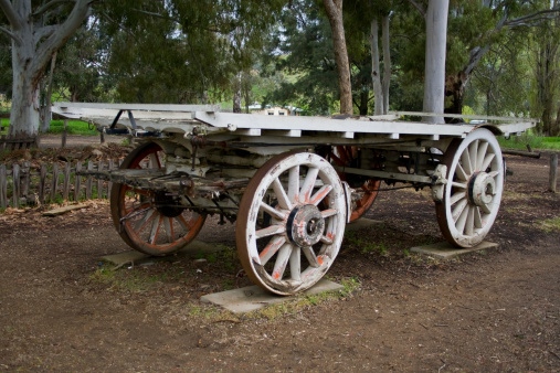 An old wooden wagon with dynamite box.