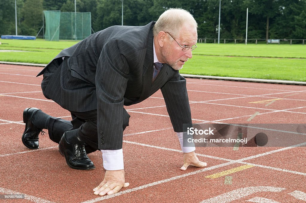 Business Man Business man ready for the start of a run. Activity Stock Photo