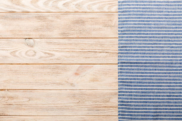istock top view with blue kitchen napkin isolated on table background. Folded cloth for mockup with copy space, Flat lay. Minimal style 1470075148