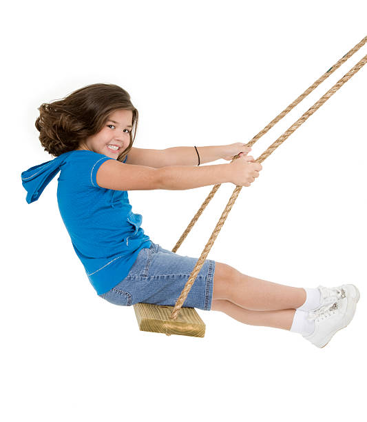 istock Smiling child on swing isolated in white background 147007779