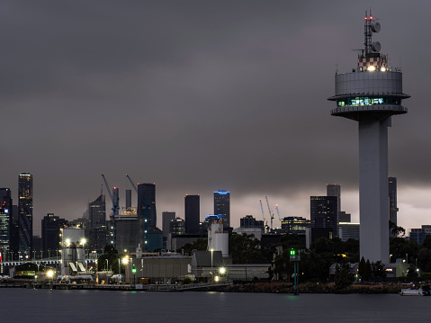 Melbourne skyline  commercial docks and marine control tower at the entrance to the Yarra River